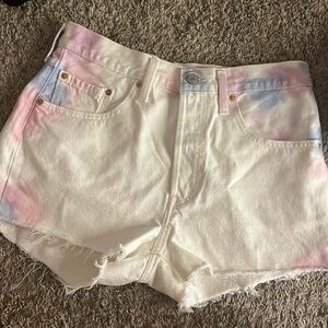 I am selling Levi’s shorts they are white with tie dye and size XL